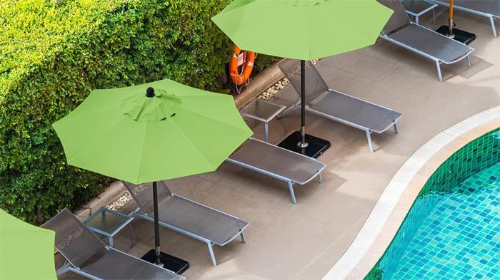 Green Patio Umbrellas by Pool